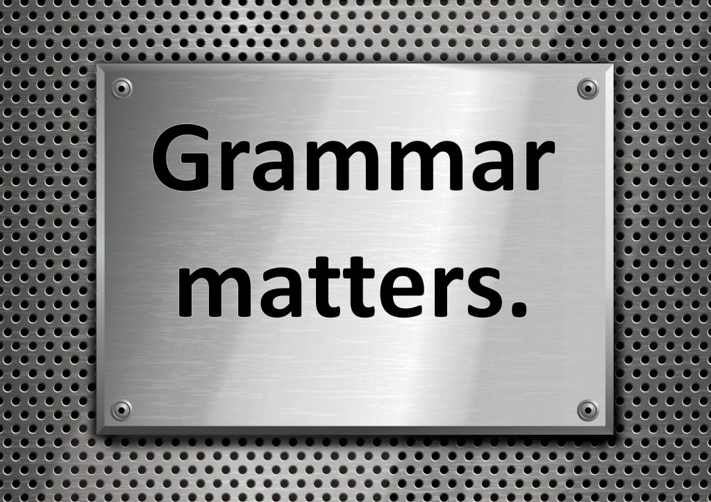 Metallic background displaying "Grammar matters".