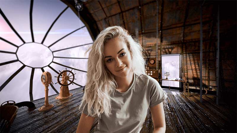 A women sitting in front of a big circular window