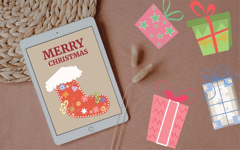 An iPad mockup with Christmas ornament vectors on display for Christmas Graphics Bundle