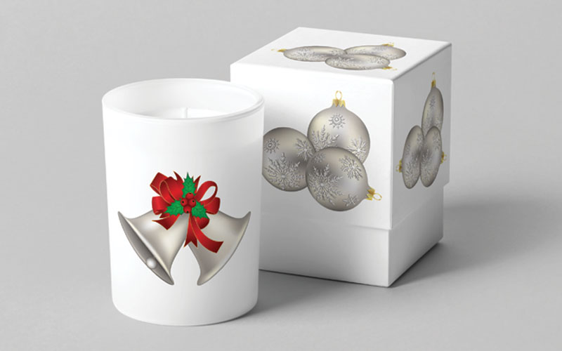 A candle and a giftbox printed with Christmas tree ornaments vectors