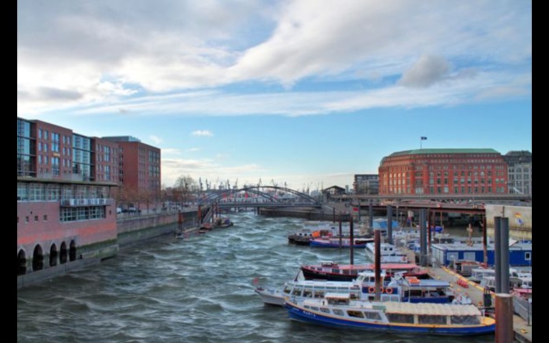 A dock with boats and buildings in the background after using HDR 9 Pro - Create High Resolution Images