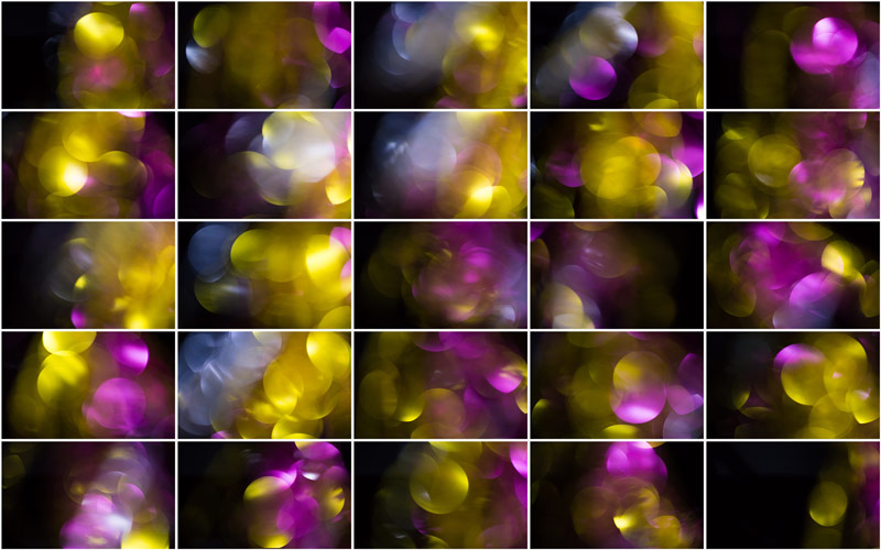 An intricate web of shimmering golden and magenta particles, forming a mesmerizing bokeh spectacle