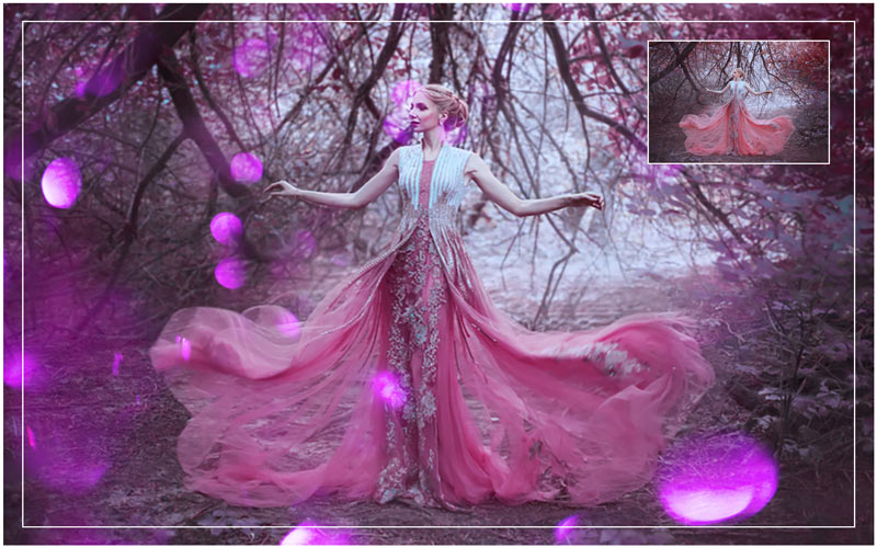 a lady in a beautiful gown posing under of a tree