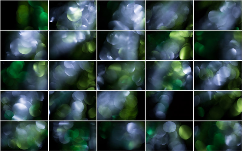 "An intricate composition of shimmering silver and green bokeh, resembling a mystical and enchanting forest."