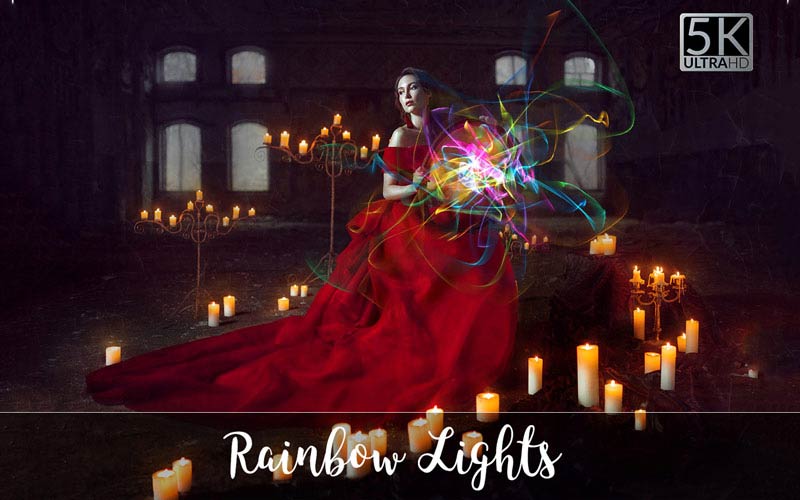 Girl in red dress surrounded by candles and rainbow Light patterns.