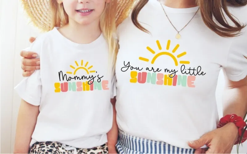 A preview of a mom and me design printed on white t-shirts