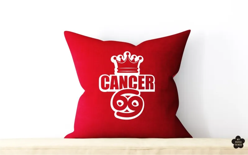 A preview of a Cancer zodiac design used on a red pillow.