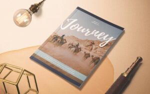 magazine mockup on a table with a cover