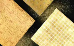 Flat lay arrangement of textured metallic papers from The Gold Backgrounds Collection.