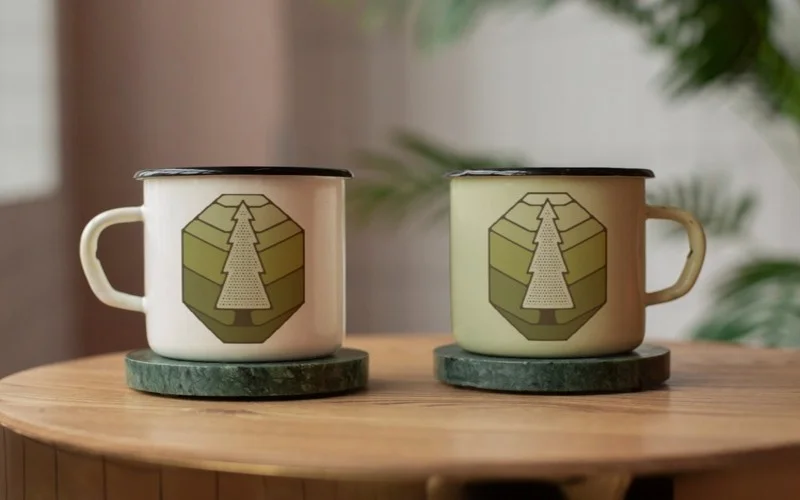 Summer Camping Badges stuck on coffee mugs
