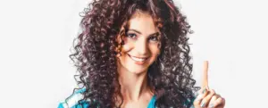 Woman with curly hair against a clean white background before using AI edge detection in CutOut 11.
