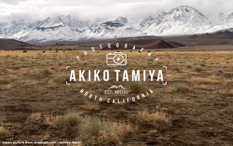 Mountain landscape background with a white vintage photography badge logo design reading Akiko Tamiya Photography, North California.