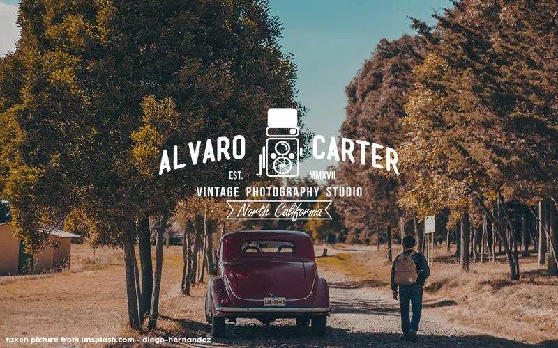 Tree-lined path with a red vintage car and a white vintage photography badge logo design reading Alvaro Carter Vintage Photography Studio, North California.