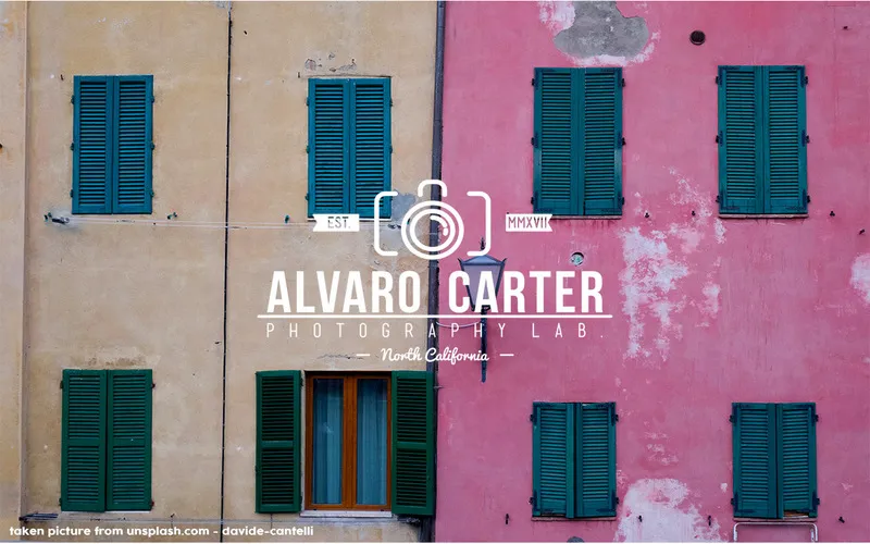 Colorful building facade with green shutters and a white vintage photography badge logo design reading Alvaro Carter Photography Lab, North California.