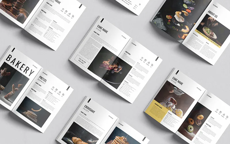 Stack of cookbooks with welcome and content pages.