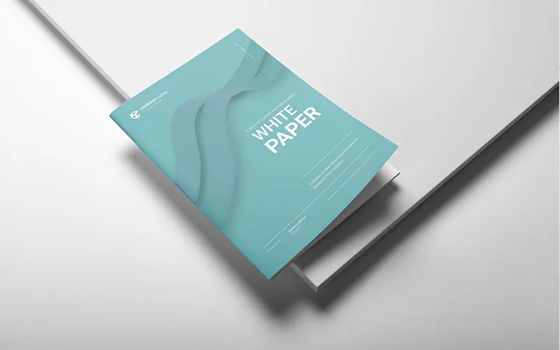 Teal white paper partially open on white surface