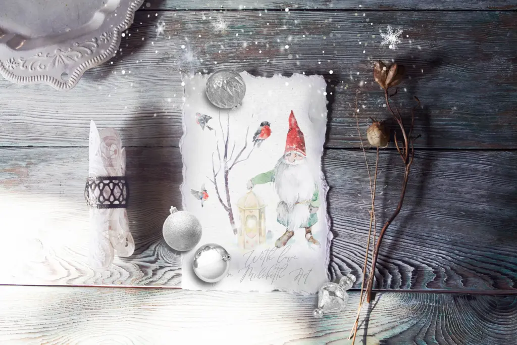 A watercolor print of a gnome and birds is decorated with silver ornaments on a rustic wood background.
