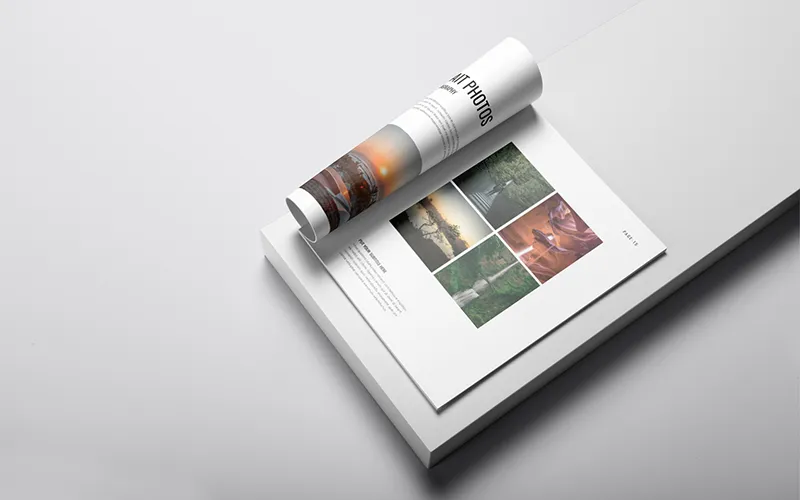 Rolled-up page and an open page from a photography portfolio book displaying various portrait photos.