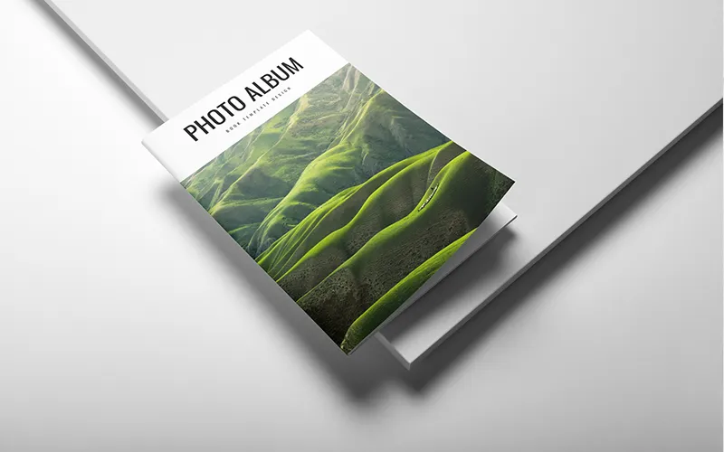 Angled photo album with green hills cover