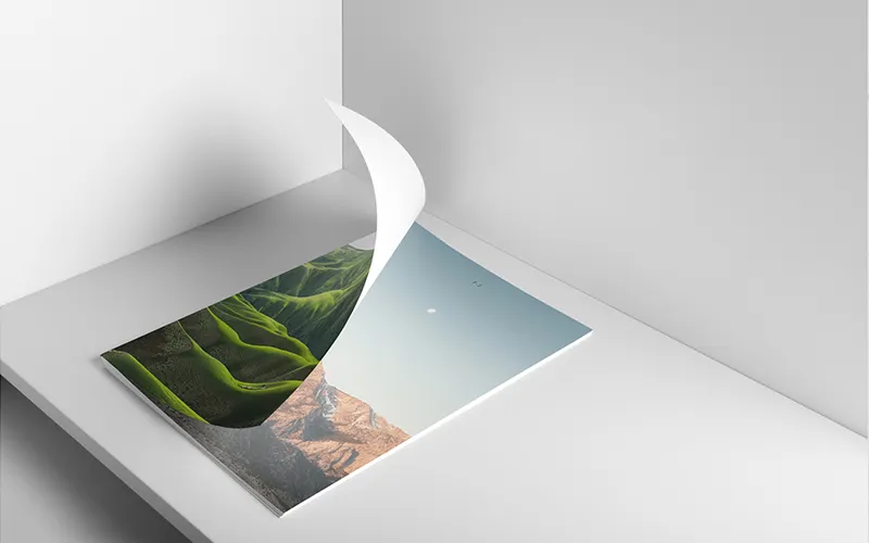 Album page turning to reveal mountain landscape