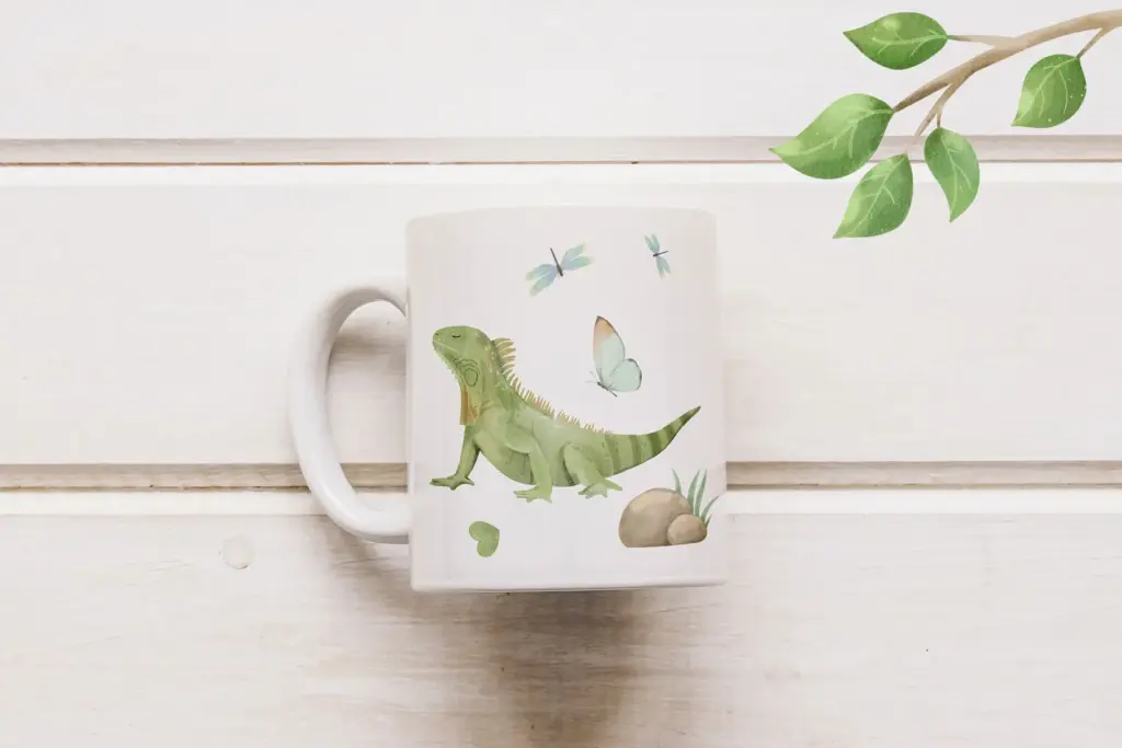 Ceramic mug with green iguana and nature-themed accents