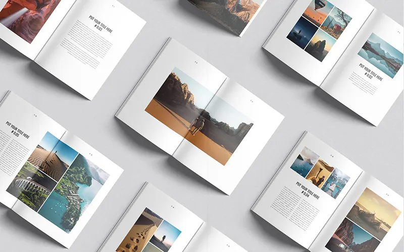 Multiple open travel books with scenic spreads