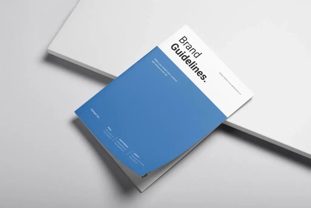 Angled mock-up of the brand guidelines cover, featuring the blue and white design with contact information.