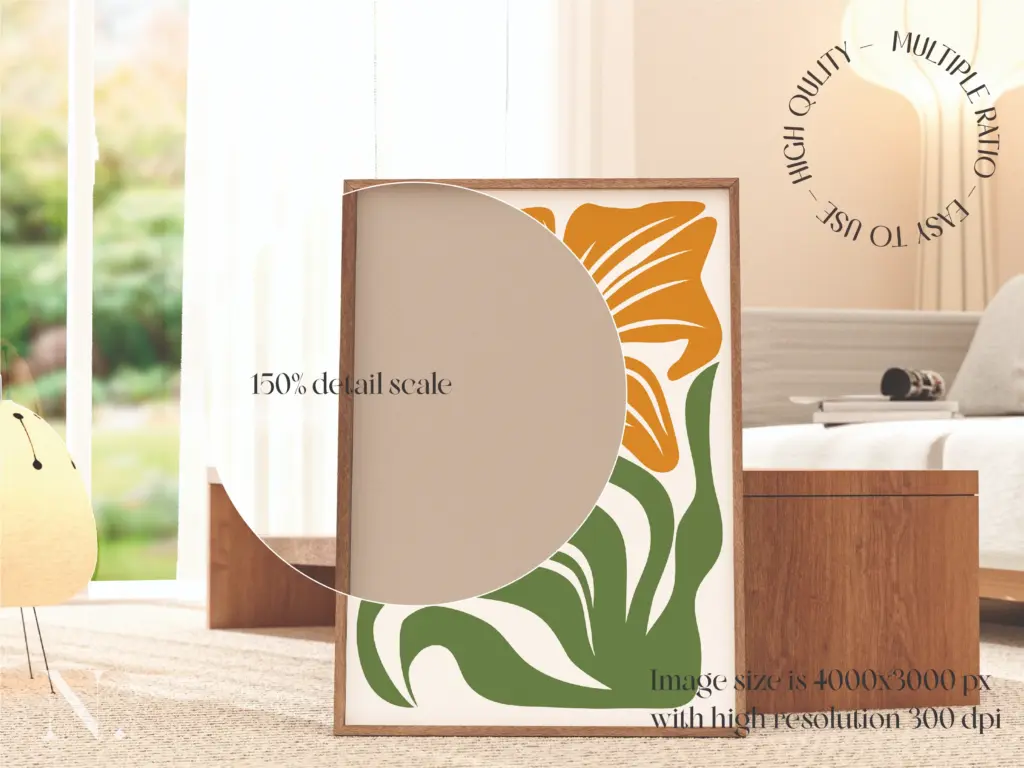 Close-up of a framed orange and green floral art print leaning in a brightly lit room.