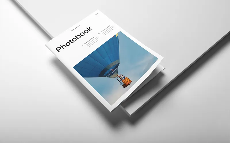 Clean photobook cover with hot air balloon and highlights like customizable layouts and durable binding