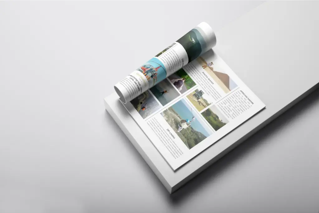 Rolled-up and open travel magazine spread showing destinations, activities, and photos, including "African Safari" and "Zip-Lining."