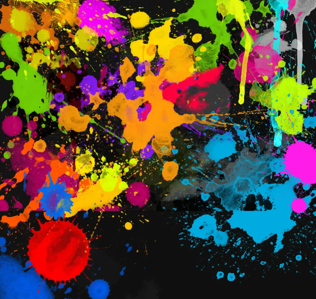 Multicolored paint splashes in chaotic arrangement on black canvas, suggesting creative intensity